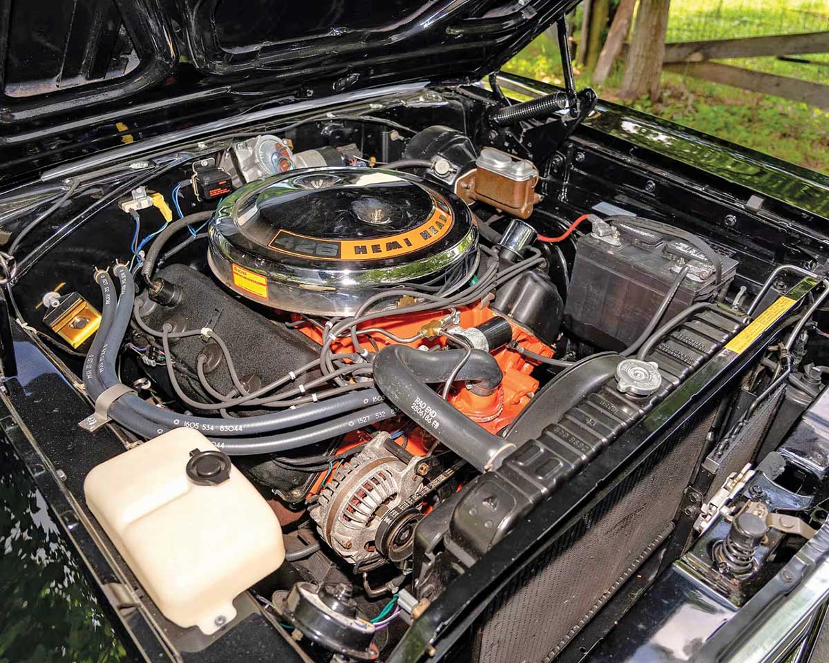 426 Hemi engine with dual Carter four-barrel carburetors.